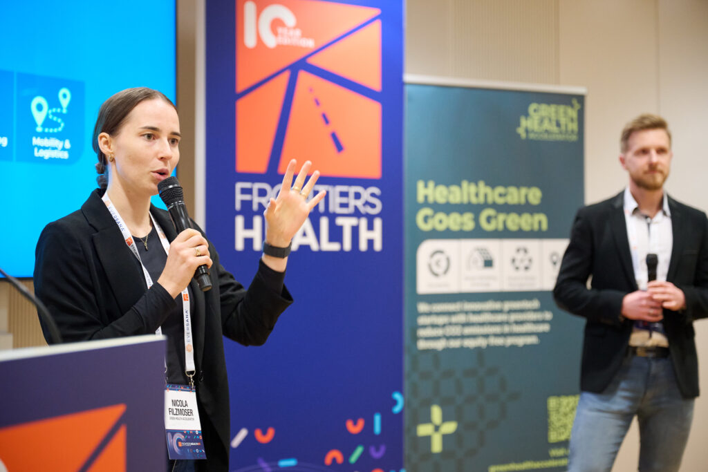 Nicola at Frontiers Health speaking in microphone